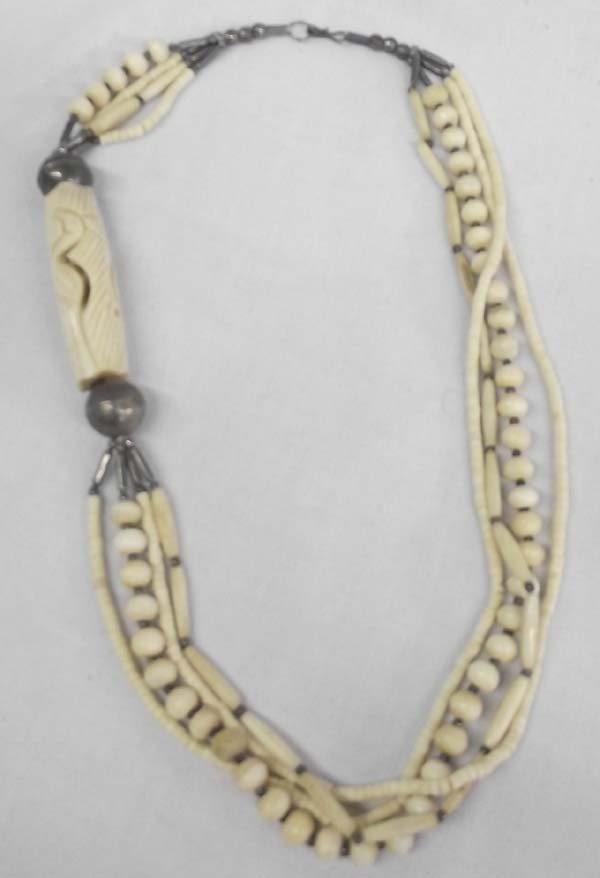 Carved Bone Sterling 4 Strand Necklace: Carved Bone Sterling 4 Strand Necklace. Vintage 4 strands, two of Heishi bone and one with hare bone separated by silver balls and the last strand is ball bone beads separated by silver balls. One lar