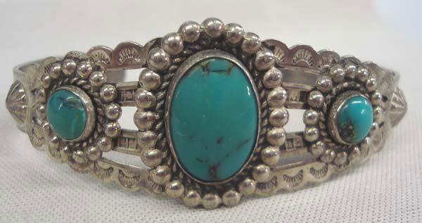 Vintage Fred Harvey Old Bell Trading Post Bracelet: Vintage Fred Harvey Old Bell Trading Post Bracelet. Sterling silver and turquoise hand crafted bracelet. Stamped and raised silver beading designs. Stamped on the inside, ''Sterling'' and has the old