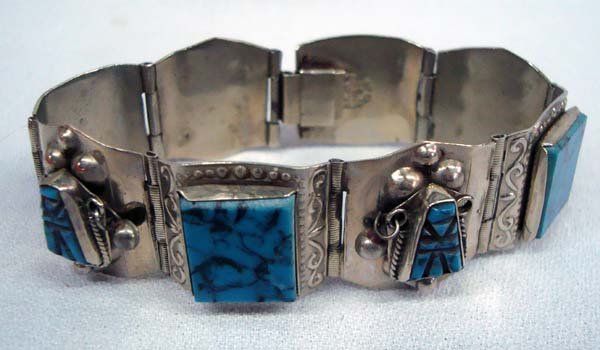 Mexican Jadeite Mayan Hallmarked Link Bracelet: Mexican Jadeite Mayan Hallmarked Link Bracelet. Mayan designs in stone. Seven 7''L x .75''W. Hallmarked ''Mexico Silver''.