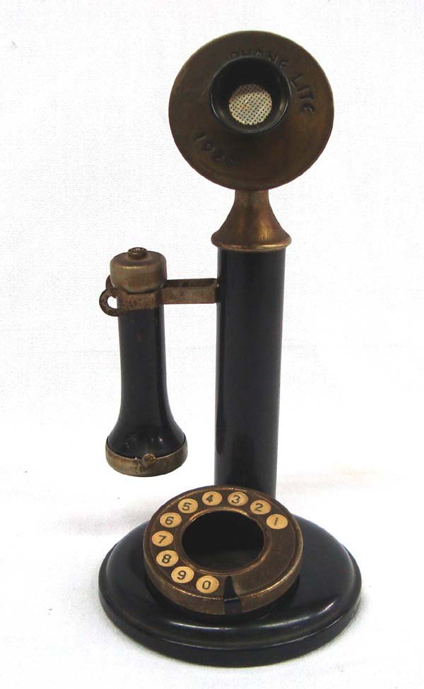 Vintage Telephone Cigar/Cigarette Lighter Ashtray: Vintage Telephone Cigar/Cigarette Lighter Ashtray. What a surprise when you pick up the hearing piece and find it is a cigarette lighter! The dial piece is a removable ash tray. On the moveable mouthp