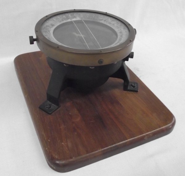 Antique Ship Compass on Walnut Base: Antique Ship Compass on Walnut Base. This interesting show compass weighs 7 lbs. Compass is 6 & 5/8'' diameter. The base is 12''L x 9''W. Would make a great conversation piece for the den.