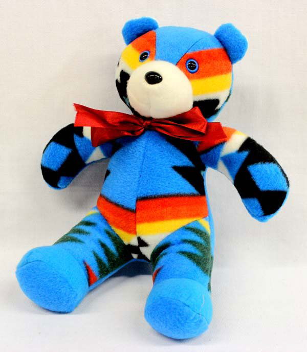 Navajo Made Fleece Teddy Bear - Gloria Billy: Navajo Made Fleece Teddy Bear - Gloria Billy. 11''H x 9''W. This cuddly little guy will put a smile on anyone's face. Clean and well stitched.
