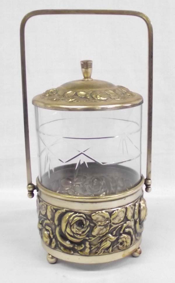 Vintage Stamped Repouse' Brass Glass Pickle Castor: Vintage Stamped Tin and Glass Pickle Castor. There are roses stamped into the tin castor and then it has been colored a gold/brass color. The glass jar has an etched line and diamond design. The lid's