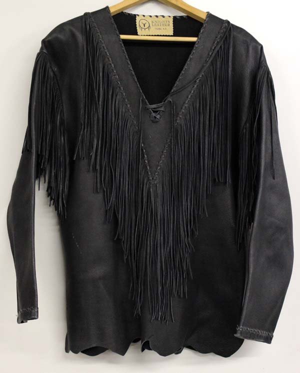 South Dakota Fringed Leather Shirt Ladies Med.: Black Leather Fringed Pullover Shirt Ladies Med. Soft, supple leather by the ''Knight's Leather, Custer SD.'' The sleeves are turned under and leather stiched. The V neck has two rows of leather stitc