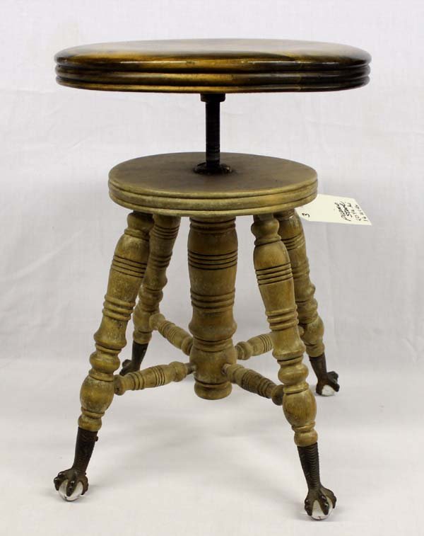 Vintage Swivel Piano Stool with Claw Feet: Vintage Swivel Piano Stool with 4 Claws clutching glass spheres feet. Hard to find swivel stools that still work and look this good. Someone may have started to refinish the base so up to your discret