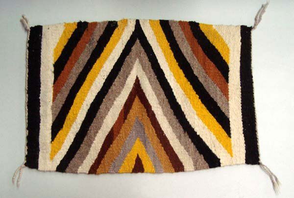 Vintage Natural Wool Rug: Vintage Natural Wool Rug. 22''L x 14''W in black, off white, browns and gold. Clean and in great shape.