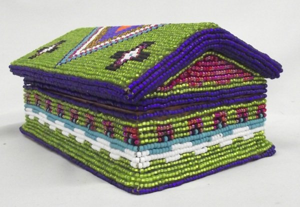 Hand Beaded Jewelry Box-Kills Thunder: Hand Beaded Jewelry Box-Kills Thunder. 4.5''H x 9''L x 6.25''W, this box has a pinch lock. Predominately green, there are geometrical designs around the base and lid. Gorgeous stand out colors.