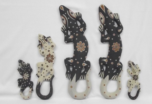 Five Albezian Wood Hand Carved Lizards, Sandcoated: Five Albezian Wood Hand Carved Lizards with Sand coated. Using sands are from Balinese Beaches in natural tones, the largest lizard is 20''L x 8.5''W. Lightweight and colorful.
