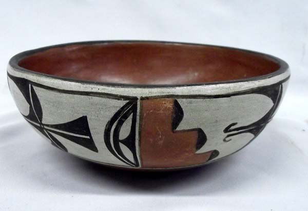 Hopi Zia Polychrome Bowl: Hopi Zia Polychrome Bowl. 2.5''H x 6.5'' diameter, the bowl is rust colored inside and on the bottom with designs in between.