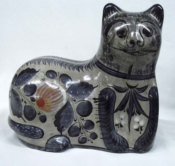 Tonala Jalisco Burnished Ware Clay Cat: Tonala Jalisco Burnished-ware Clay Cat. Tonala is a city and its surrounding municipality within the Guadalajara Metropolitan Area in the state of Jalisco in Mexico. This cat doesn't eat much and look
