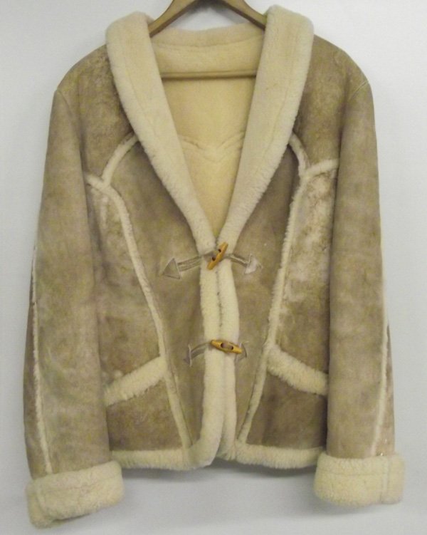 California Ranchwear Shearling Coat Ladies 14: California Ranchwear Shearling Coat Ladies 14. Ladies 2 button shawl collar shearling coat in very nice condition. There are leather button loops and wooden buttons. Label is in right pocket, says, ''