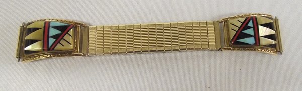 Hopi Stone on Stone Watch Tips-Michael Kabotie: Hopi Stone on Stone Watch Tips-Michael Kabotie. 1/20 12 KGTGF watch tips with Speidel stretch band. Mother of Pearl, coral, jet, turquoise geometric designs are beautifully set in these tips. Tips mea