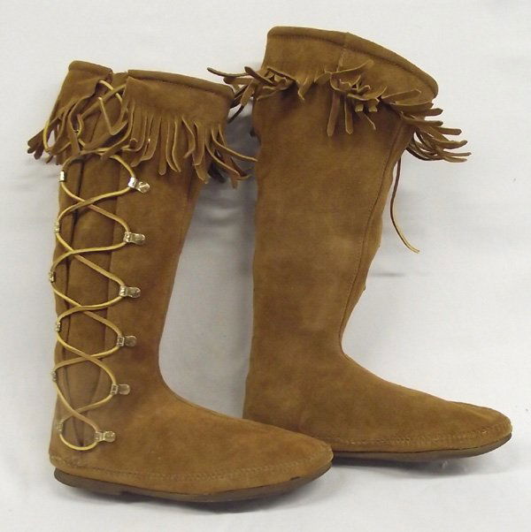 Minnetonka High-Top Suede Lace-Up Boots: Minnetonka High-Top Suede Lace-Up Boots. Like new boots are a ladies size 10. They have fringes at the top and leather laces through brass loops. Measure 16'' high from top to bottom of sole.