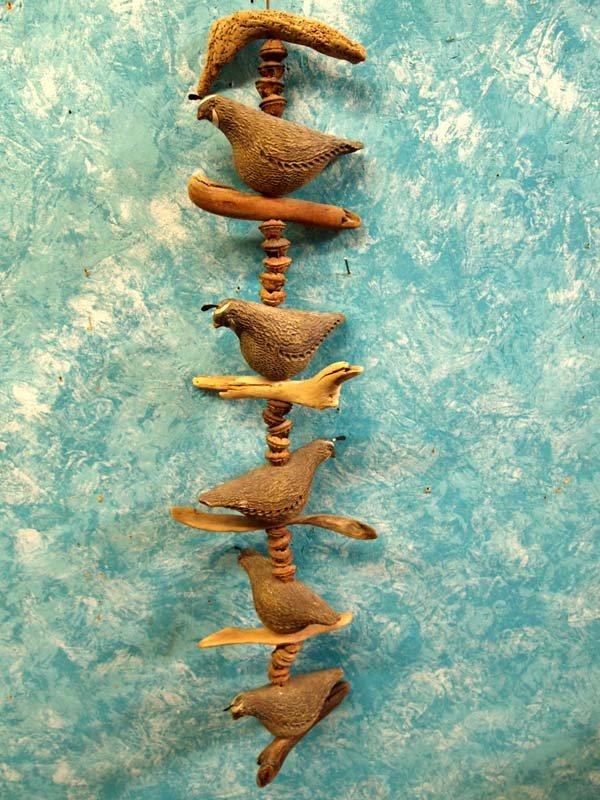 Pottery Quail with Natural Driftwood Hanging: Pottery Quail with Natural Driftwood Hanging. Measures 40''L. Quail 4.5''H x 3''W. Beautiful art piece that would function indoors as well as outdoors.