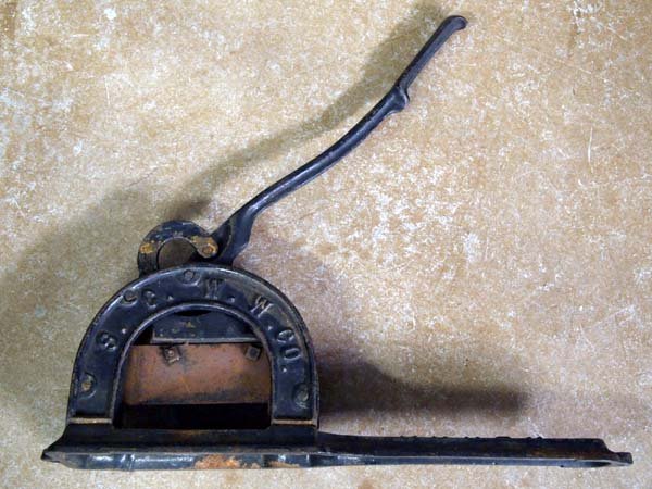 Antique Arrow Tobacco Cutter: Antique Arrow Tobacco Cutter. S.C.W.W.Co. 18''L x 6.75''W. This antique tobacco cutter was used in general stores to cut plug tobacco to order. At one time it was popular to purchase plug tobacco by t