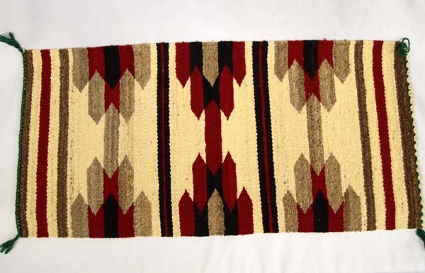 Navajo Woven Textile: Navajo Woven Textile. 36''L x 18''W. Lovely textile, good condition. Navajo rugs and blankets are prized by collectors all over the world for their beauty and durability. They are truly among the grea
