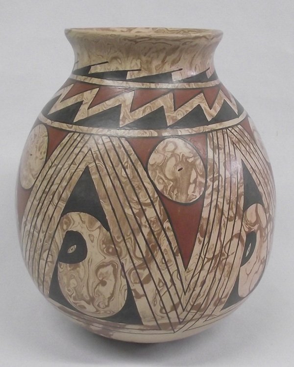 Mata Ortiz Marbleized Pottery Jar - Luis Ortiz: Mata Ortiz Marbleized Jar - Luis Ortiz. A beautifully made jar by the talented artist from Mata Ortiz, Mexico, Luis Ortiz. This is a polychrome in tan, brown, redish brown and black. It is signed on t