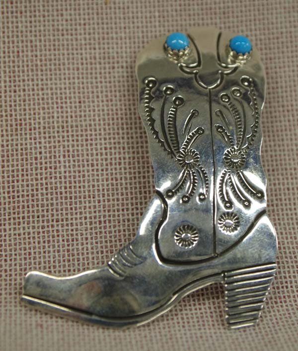 Navajo Boot Pin/Pendant Stamped Sterling Turquoise: Navajo Boot Pin/Pendant Stamped Sterling Turquoise cabochons. Hallmarked RB with the bear symbol surrounding it, measures 3/8''L x 1 5/8''W. The wearer will get a kick out of this pin!