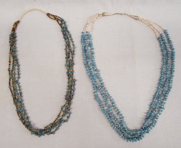 Pr Navajo Turquoise and Heishi Shell Necklaces: Two Turquoise and Heishi Shell Necklaces. 1) Four strands with stone and brown heishi shells. Neck has traditional string wrap. 2) Three strand with off white heishi shells, neck bound on sterling con