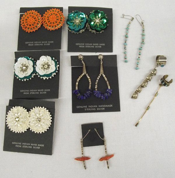 Collection of Native American Ear Jewelry: Collection of Native American Ear Jewelry. Seven pair total. Four pair are clip- on beaded flower style of intricate designs. One pair has lapis blue stones, 2 1/8''L x 3/4''W and heishi and cone atta