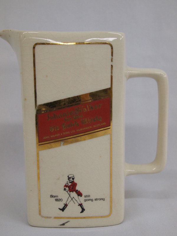 Seton Ceramic Johnnie Walker Red Label Pitcher: Vintage Johnnie Walker Red Label Ceramic Pitcher. This vintage pitcher is stamped on the bottom, ''Seton Pottery Scorrier Redruth Cornwall England. The finish is worn and crazed, as is consistent with