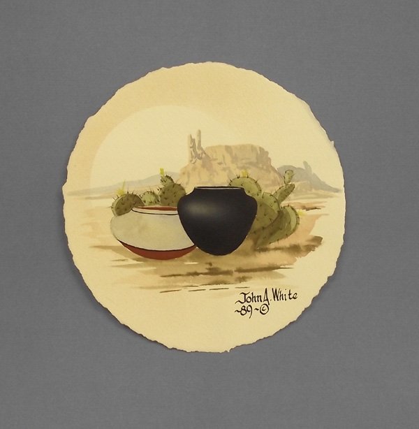 Original Watercolor Desert Scene - John White: Original Watercolor Desert Scene - John White. The desert cactus seem to be blooming pueblo pottery in this lovely scene signed by the artist, John A. White, 1989. It measures 7-5/8'' diameter.