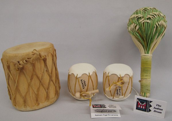 Hopi Miniature Drums Basket Rattle: Hopi Miniature Drums & Basket Rattle. The two smallest drums have tags and measure 2''x2''. The largest drum has rawhide stretched over wood and measures 3.5''H x 2.75''W. The basket rattle is woven r