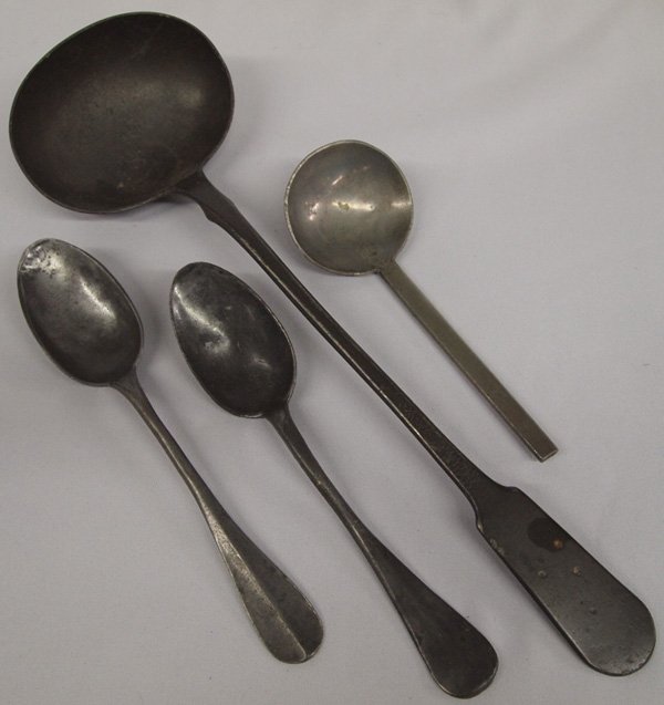 Four Antique Pewter Spoons and Ladle: Four Antique Pewter Spoons and Ladle. Largest ladle is 14''L x 4.25''W. Smaller spoon has TH signature and fancy lion crest on the back side. Pewter historically was an alloy of *tin and lead (up to 5
