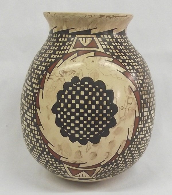 Mata Ortiz Polychrome Marbelized Jar - Luis Oritz: Mata Ortiz Polychrome Marbelized Jar - Luis Oritz. Three cirlces surround the jar with black rosette type designs. Eye dazzler squares and diamonds fill the areas inbetween. Signed on the bottom by ar