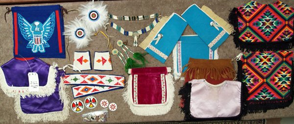 Navajo Childrens Pow Wow Costumes & Accessories: Child's Native American Pow Wow Items. Included in this large lot are: 2 pairs of felt and embroidary cuffs and a matching belt; a pair of beaded hair ties (beaded rosettes surrounded by white feather
