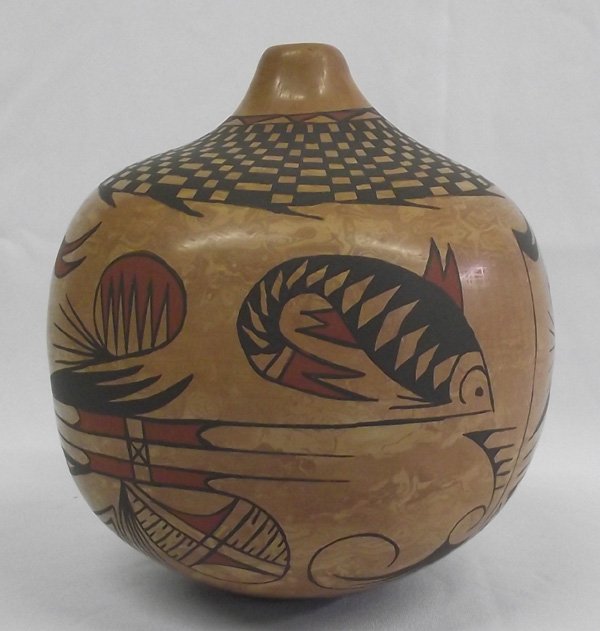 Mata Ortiz Polychrome Marbleized Pot - Enriguez: Mata Ortiz Polychrome Marbleized Pot-Tito Enriguez. 8''H x 8'' diameter, fish swim around this beautiful jar. Mata Ortiz is a small village in the state of Chihuahua, Mexico. The potters of Mata Ortiz
