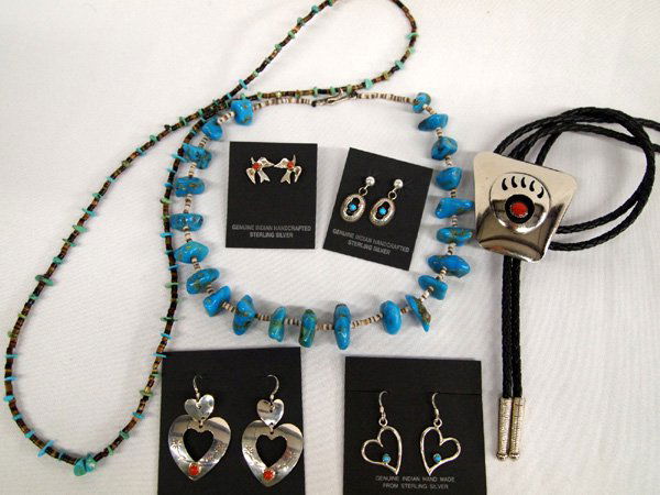Collection of Native American Jewelry: Collection of Native American Jewelry. 1) Hopi bear claw bolo tie is 36''L 2''L x 2''W, made of nickel silver. 2-3) Turquoise and shell heishi necklaces, longest 25''. 4-7) two heart shaped on French