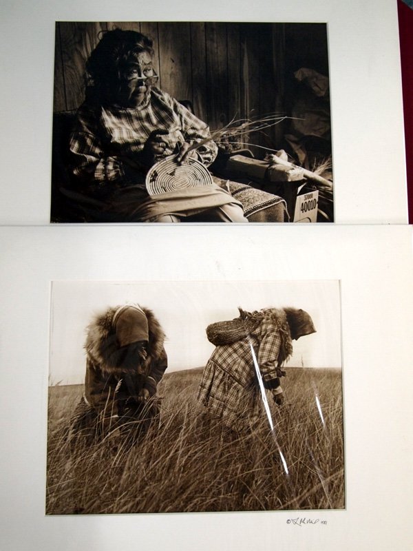 2 1981 Original Native American Photos - McNeil: Two Original Native American Women Photos Matted. Signed by photographer 1981. 1) Older woman weaving a basket 2) women picking fiber material for weaving projects. 9.5''H x 15''W.