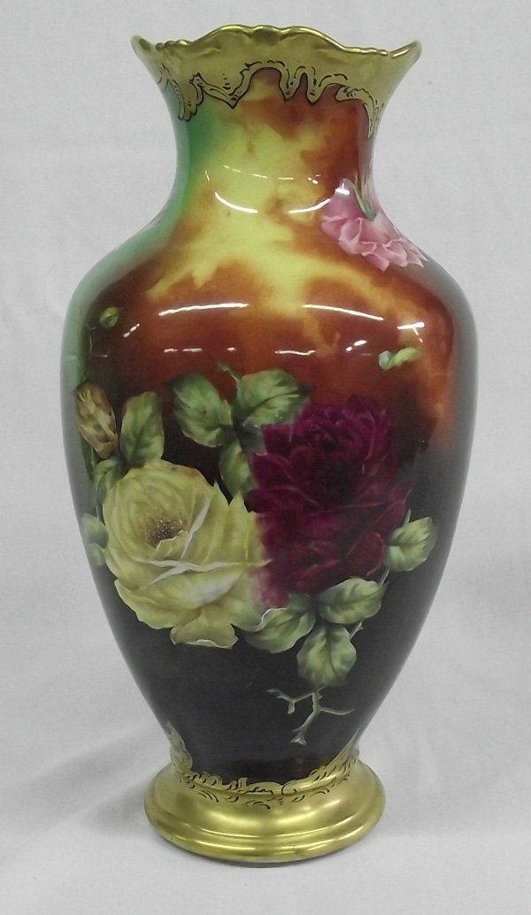 Antique Turn of Century T&V Limoges Gold Gilt Vase: Antique Turn of the Century T&V Limoges Gold Gilt Vase. This is a gorgeous hand painted Limoges vase with gold gilt around the base and the rim. Roses surround the body of the vase. It is signed by th