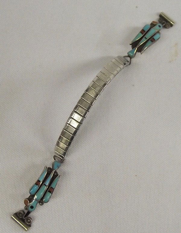 Zuni Stone to Stone Watch Tips: Zuni Woman's Watch Tips. Tips are bird figures of stone to stone inlay turquoise, coral and jet. Each tip is 1-3/8''L x 3/8''W and are attached to an expandable watch band.