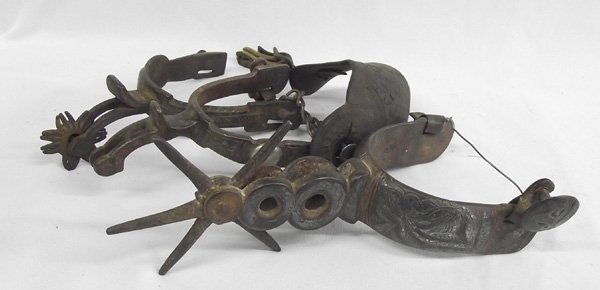3 Antique Western Spurs: 3 Antique Western Spurs. Great old heavy spurs that would be wonderful decor. The largest is a Mexican spur with a 4'' star rowell. It's overall length is 8.25''.
