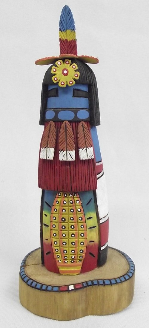 Hopi Kachina - Harold Ami: Hopi Kachina - Harold Ami. Bright colors and fine carving on this Hopi Kachina by famous artist, Harold Ami. It measures 6''H x 2.75''W at the base stand.