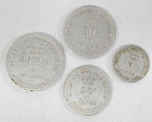 Four 1900 Bylas Arizona Trading Post Trade Tokens: Four 1900 Bylas Arizona Trading Post Trade Tokens, to include 1.00 token, 50 cents, 25 cents and 10 cent tokens.