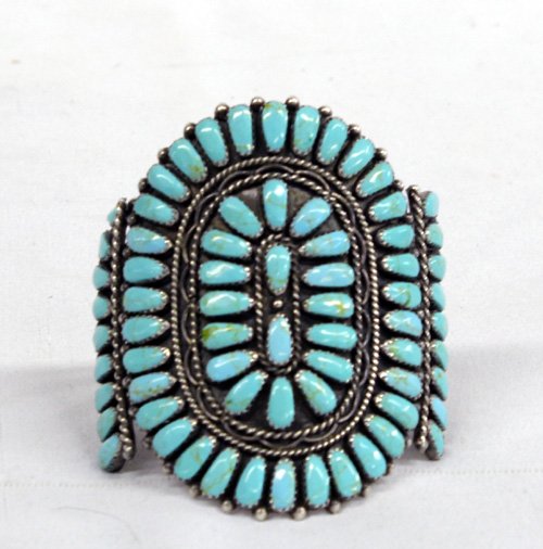 Navajo Silver Turquoise Cluster Bracelet - Mae Bia: Navajo Silver Turquoise Cluster Bracelet - Mae Bia. Tremendous old pawn vintage Navajo traditional cluster bracelet. Wonderful collection of blue green turquoise cabochons. They are shaped into wide t
