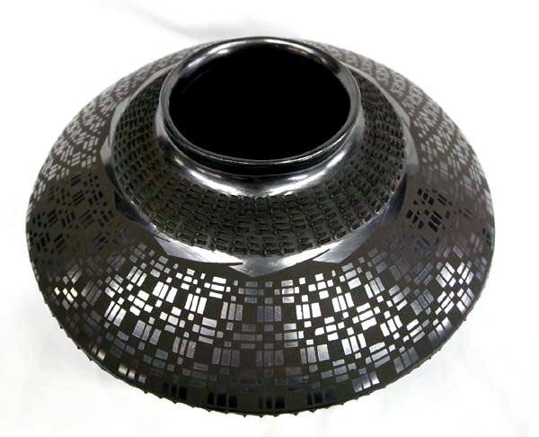 Mata Ortiz Textured Black on Black Bowl - M Olivas: Mata Ortiz Textured Black on Black Bowl - M Olivas. Large, well balanced bowl with indention type texturing around the neck and below the midline of the bowl. Signed on the bottom Mario Olivas. Measur