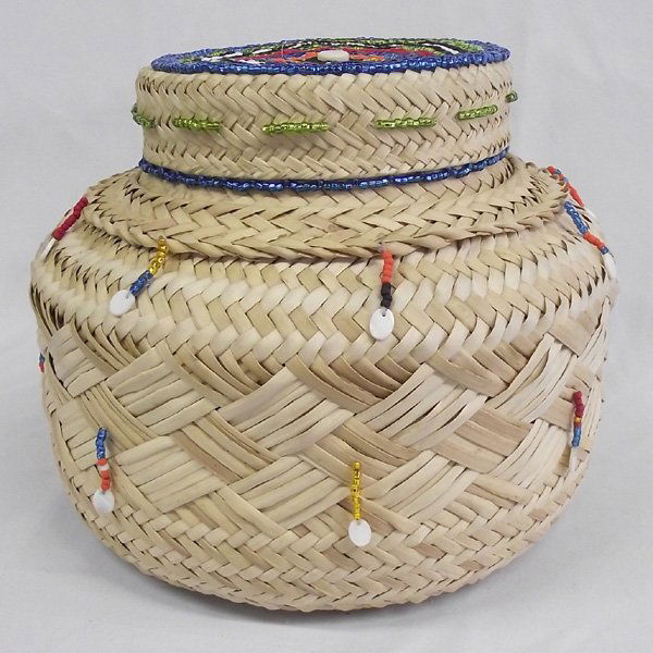 Large Woven Beaded Basket by Kills Thunder: Large Woven Basket Beaded by Kills Thunder. Arizona artist, Kills Thunder, gives this basket a light touch of colorful beading on the top of the lid and hanging around the sides. Beauty and usefullnes