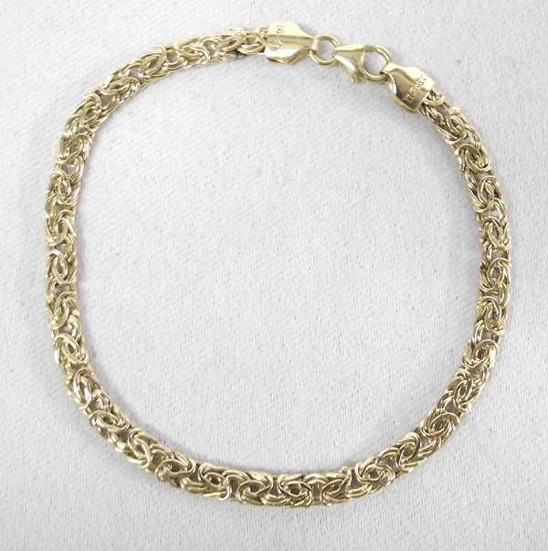 14Kt Gold Chain Bracelet: 14Kt Gold Chain Bracelet. Intricate Byzantine bracelet is 14Kt gold. Measurses 7-1/8'' Long x 1/8'' wide. Weighs 0.110oz, 3.1 gram, 0.100ozt.