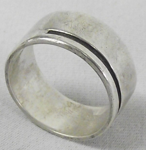 Navajo Sterling Silver Handmade Large Band Ring: Navajo Sterling Silver Ring. Handmade ring with single incised line design. Measures 3/8'' wide and is size 9.
