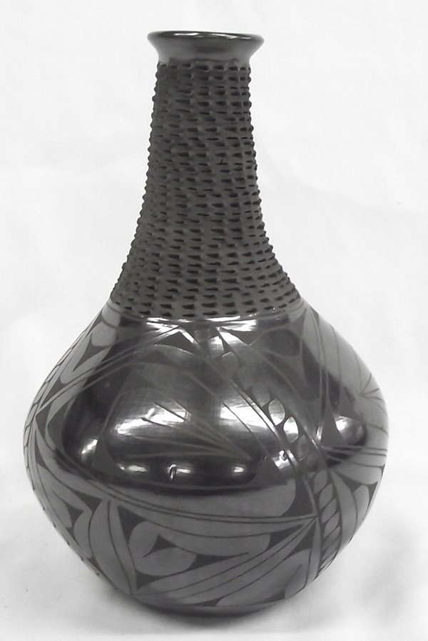 Mata Ortiz Black on Black Olla - Cesar Sandoval: Mata Ortiz Black on Black Olla - Cesar Sandoval, this beauty features highly burnished geometric designs and a highly textured neck and flared spout, measures approx. 9'' x 6''