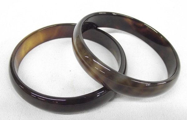 Pair Tiger Eye Agate Bangle Bracelets: Pair Tiger Eye Agate Bangle Bracelets, beautiful rich brown with golden colors interspersed, measures 3''D and an inside measurement of 8.25''