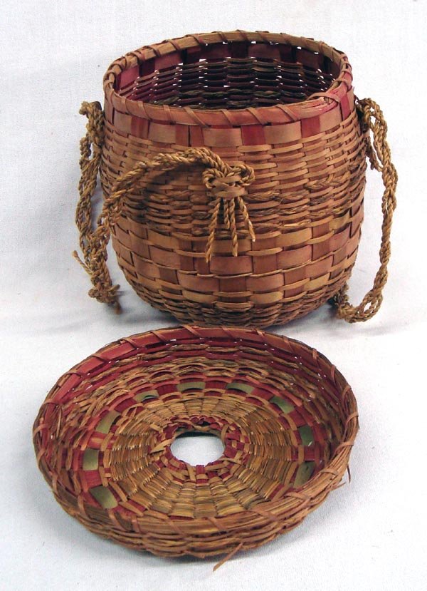 Penobscot Lidded Easter String Woven Basket: Penobscot Lidded Easter String Woven Basket. Penobscot (or other NE American/Canadian tribe) basket, expertly woven with several types of material in different weave patterns and twisted braid handles