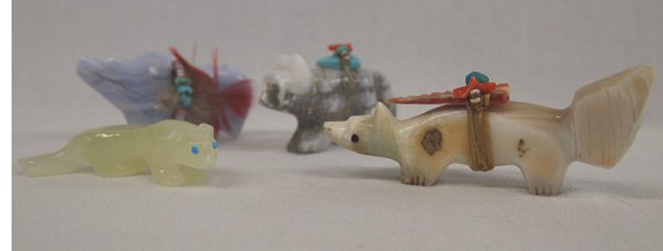 Four Zuni Stone Fetish: Four Zuni Stone Fetish. Cougar has turquoise eyes. Signed ''Zuni, SC, 04''; Bear has power pack and spirit line. Fox has power pack and interesting natural stone variations. The fourth fetish has a po
