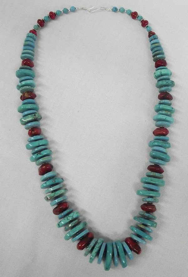 Santo Domingo Turquoise, Coral Necklace- Terico: Santo Domingo Turquoise, Coral Necklace- Tawnie Terico. Large graduated rondelles, largest measuring 1'' x 5/8''. End to end necklace is 26''. Santo Domingo Pueblo is one of the best known tribes of t
