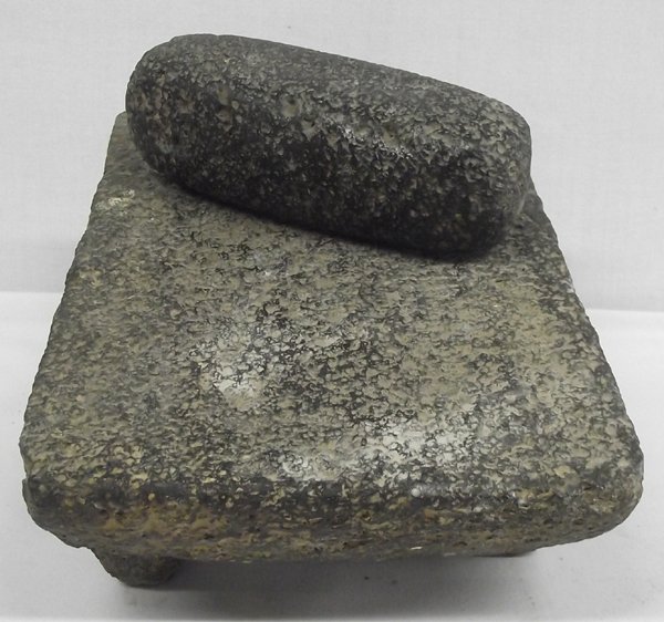 Prehistoric Mexican Stone Metate and Mano: Prehistoric Mexican Stone Metate and Mano, tri-legged slanted metate and oblong grinding stone is made of basalt, mano is oblong with 6 flat smooth faces, the rough surface of the basalt stone creates