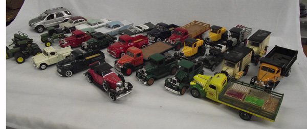 Collection National Motor Museum Mniature Metal Cars: Collection of National Motor Museum Mint Vehicles. Twenty-eight cars and trucks, most with certificates of authenticity. The lot includes: 1. John Deere (Ertl) 4710 Self-Propelled Sprayer. 2. Superior